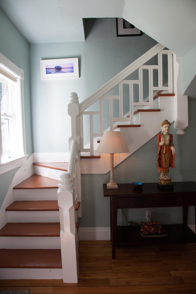 Medium sized victorian wood railing staircase in Sacramento with wood risers and feature lighting.