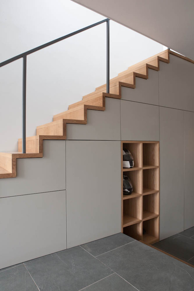 Contemporary staircase in Other with under stair storage.
