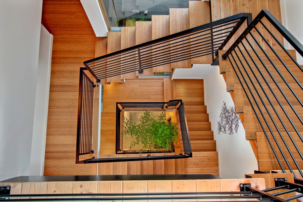 Trendy wooden staircase photo in Seattle