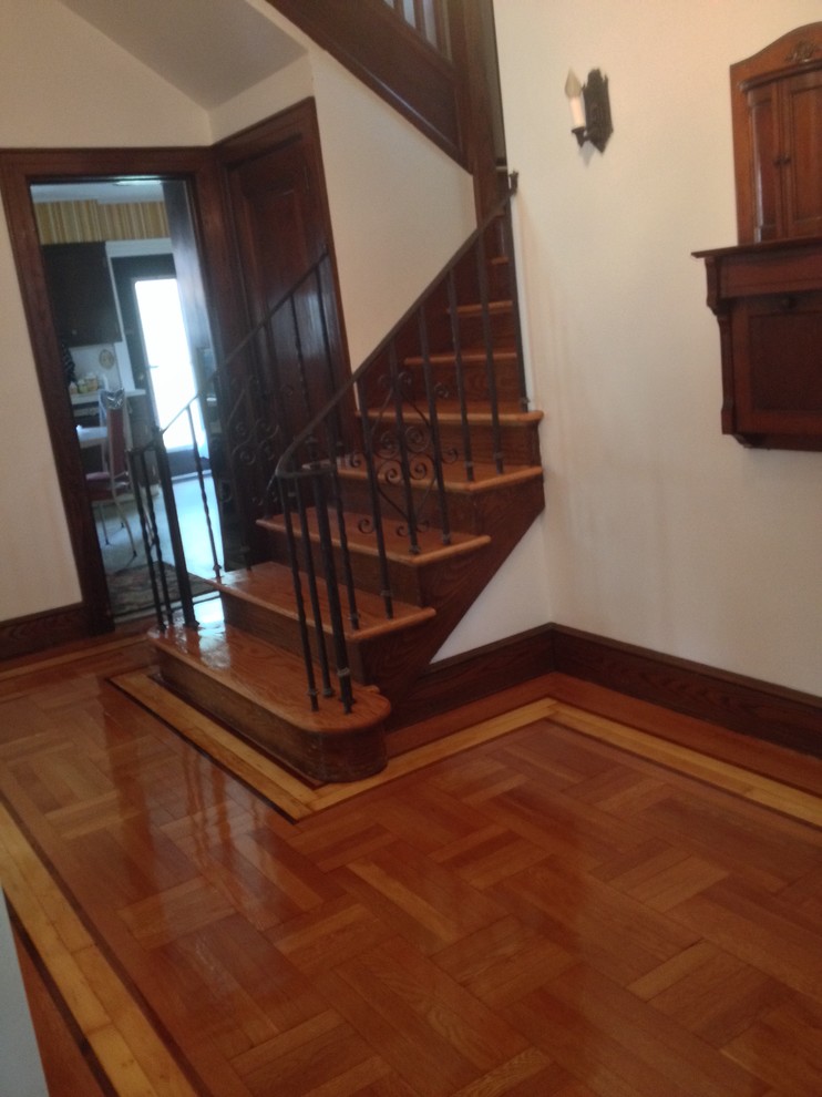 Inspiration for a medium sized classic wood curved staircase in Newark with wood risers.