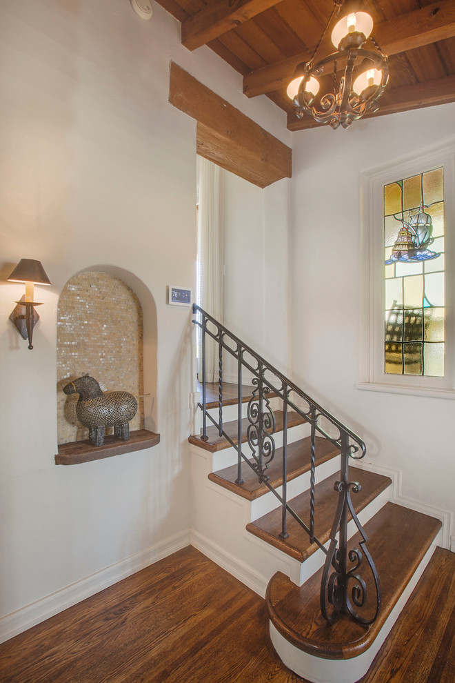 Small mediterranean wood straight staircase in Los Angeles.
