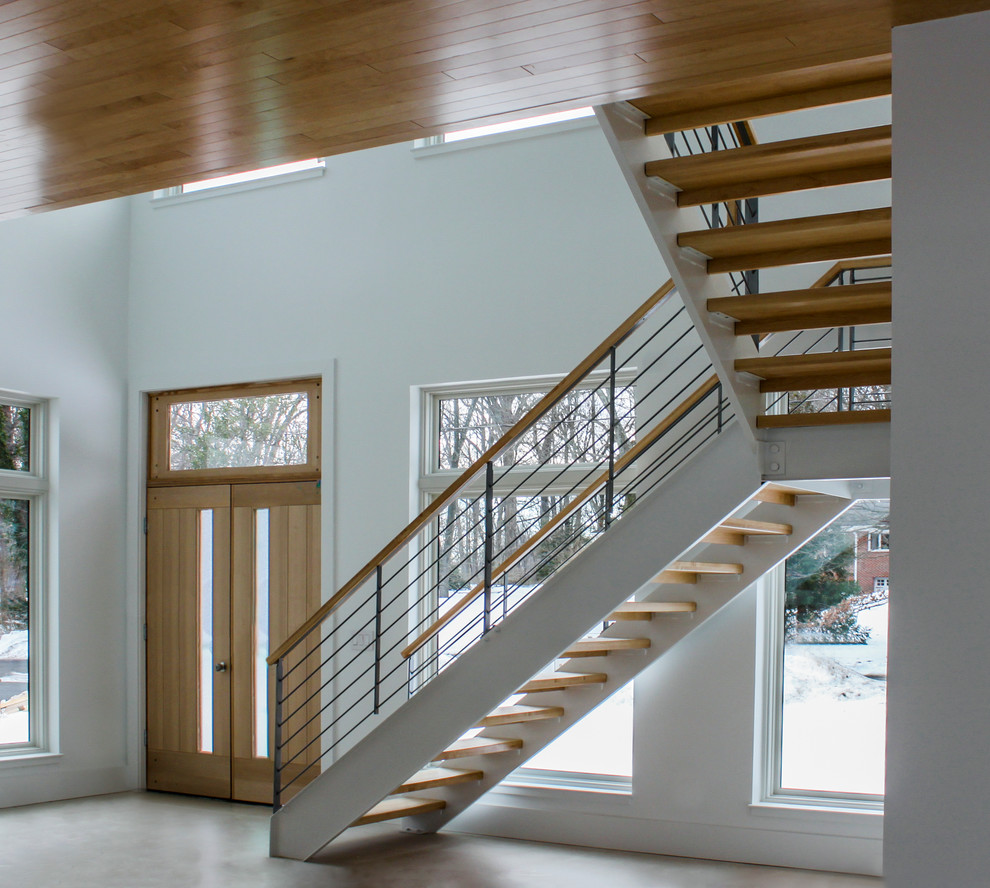 Cette image montre un escalier style shabby chic en L de taille moyenne avec des marches en bois et un garde-corps en matériaux mixtes.