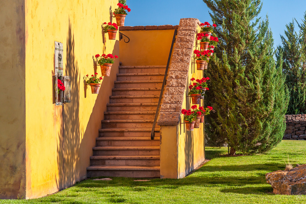 Staircase - mid-sized mediterranean staircase idea in Other