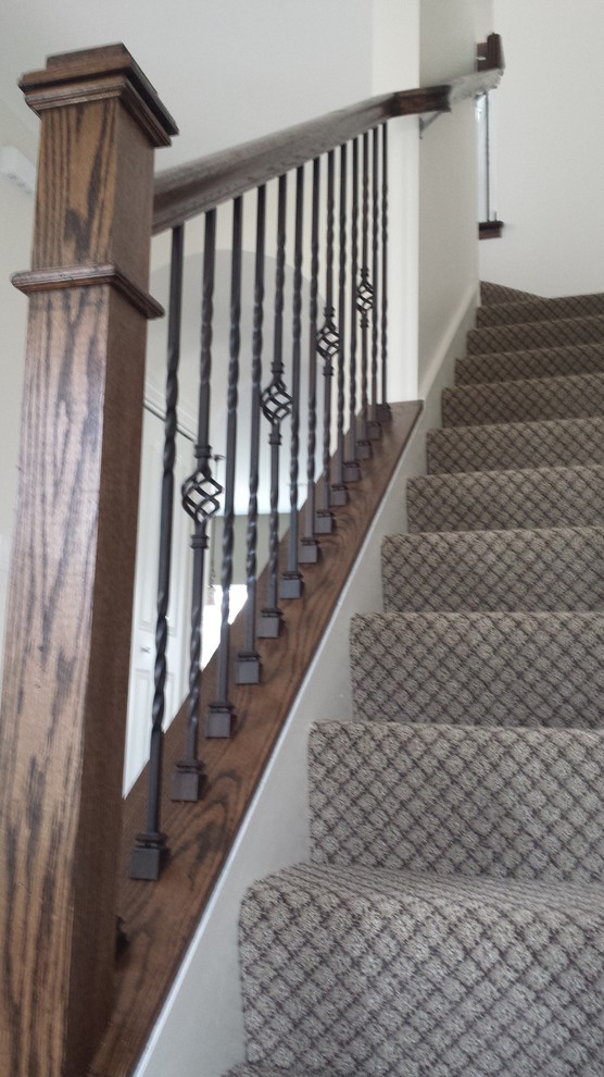 Inspiration for a classic carpeted l-shaped staircase in Chicago with carpeted risers.
