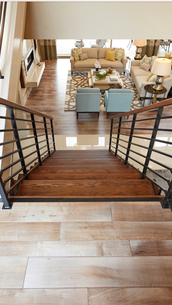 Large classic wood straight staircase in Dallas with open risers and feature lighting.