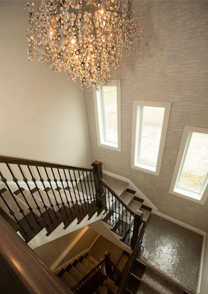 Design ideas for a medium sized traditional carpeted spiral staircase in Columbus with carpeted risers.