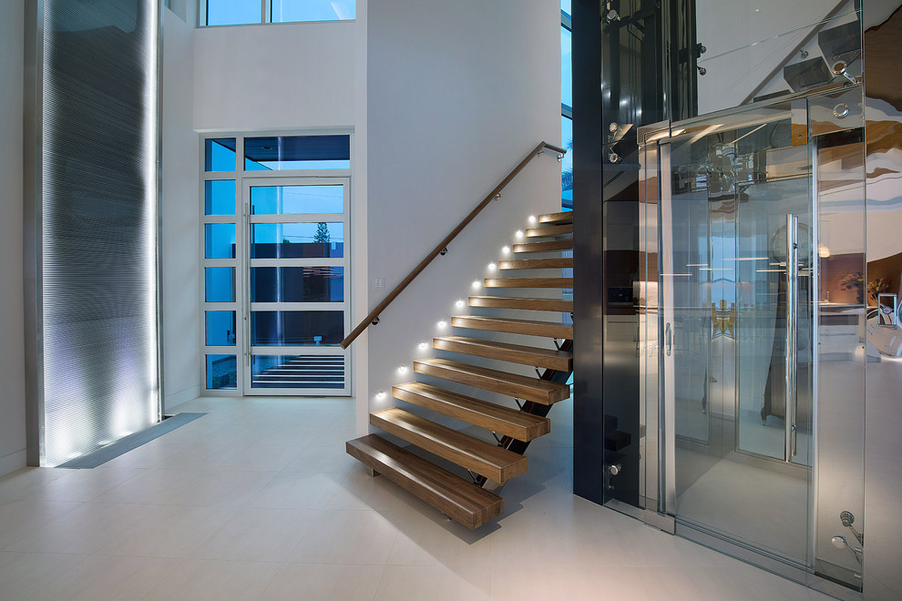 Photo of a contemporary wood l-shaped staircase with open risers.