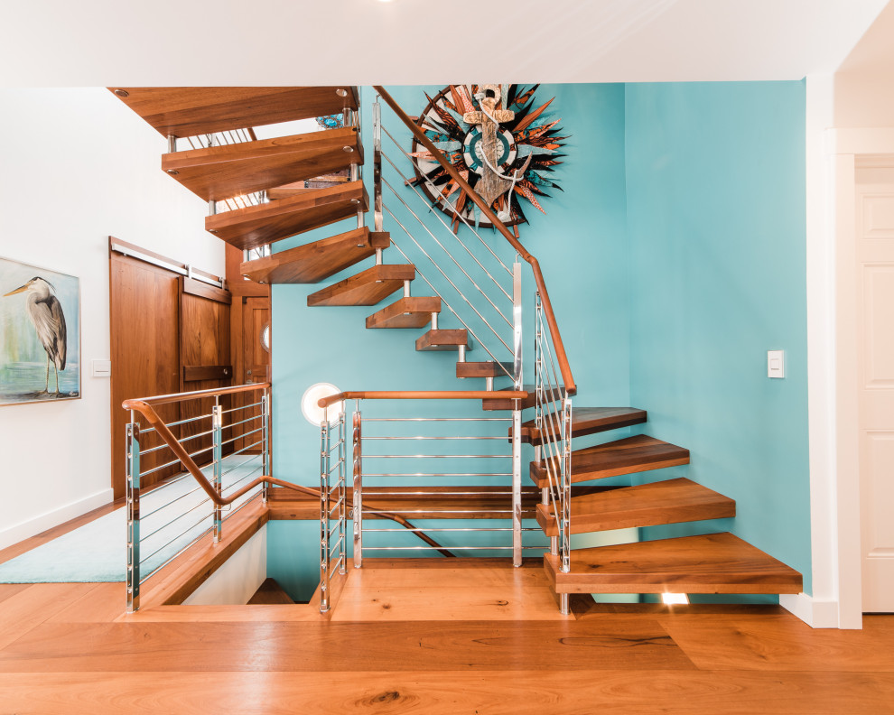Modelo de escalera recta actual con escalones de madera y barandilla de metal