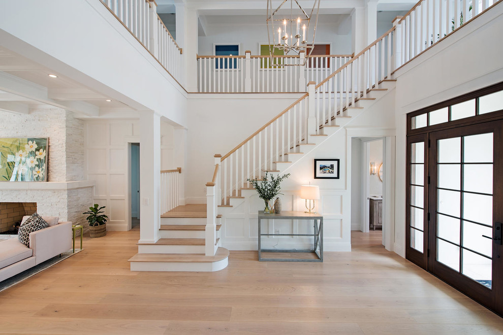 Coastal wood l-shaped staircase in Miami with painted wood risers and feature lighting.