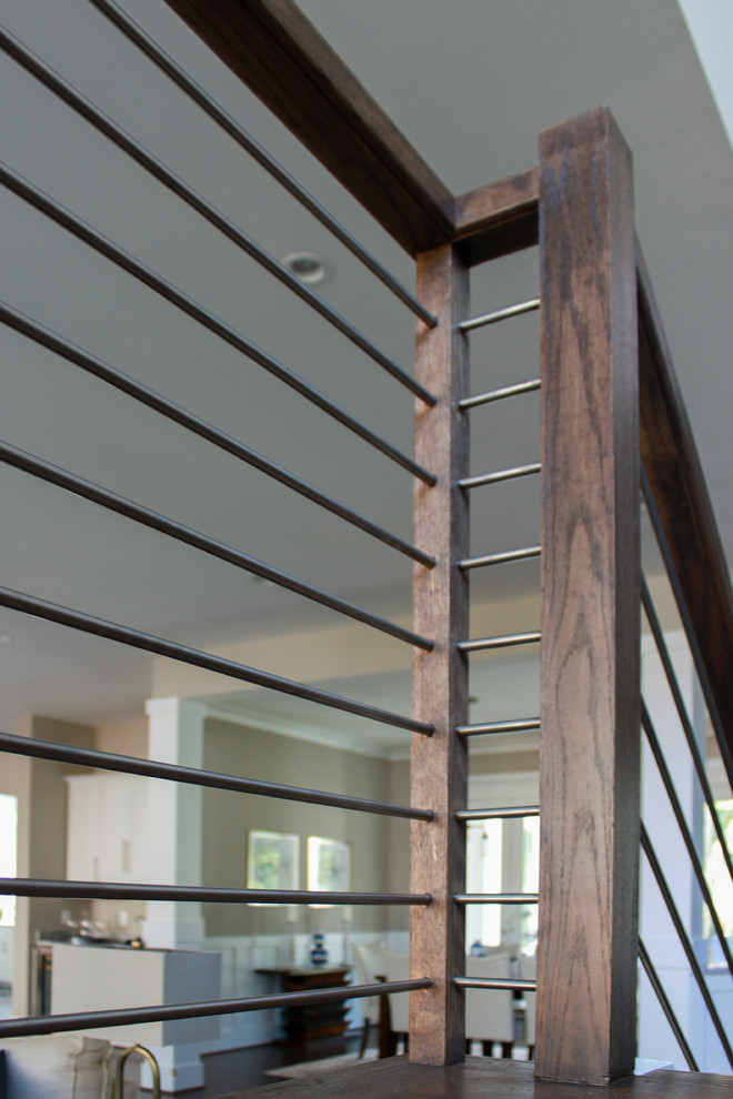 Ejemplo de escalera en U contemporánea grande con escalones de madera y barandilla de varios materiales