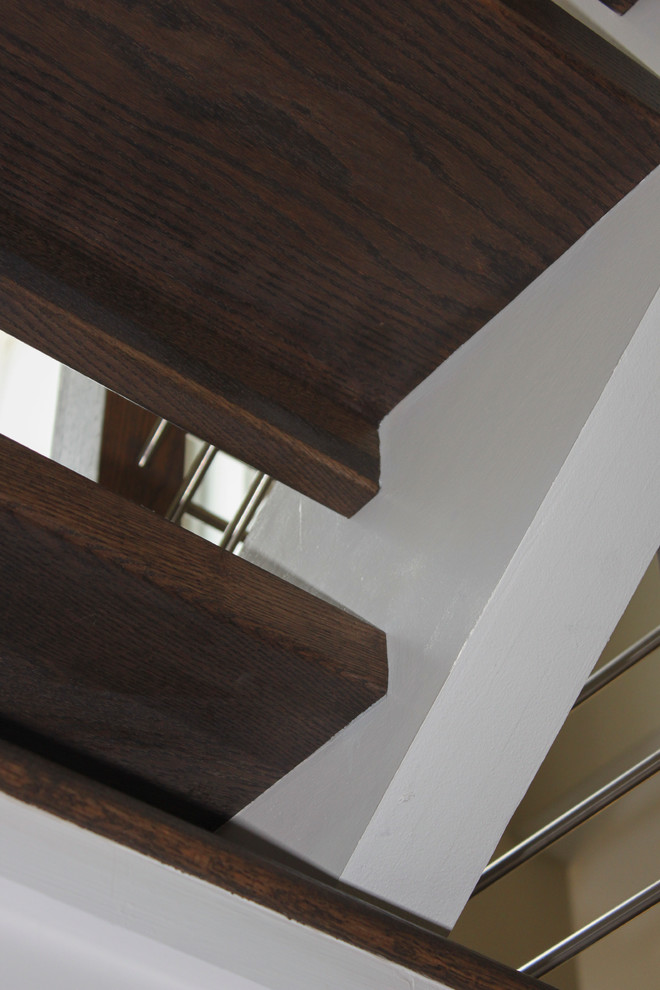 Large trendy wooden u-shaped mixed material railing staircase photo in DC Metro