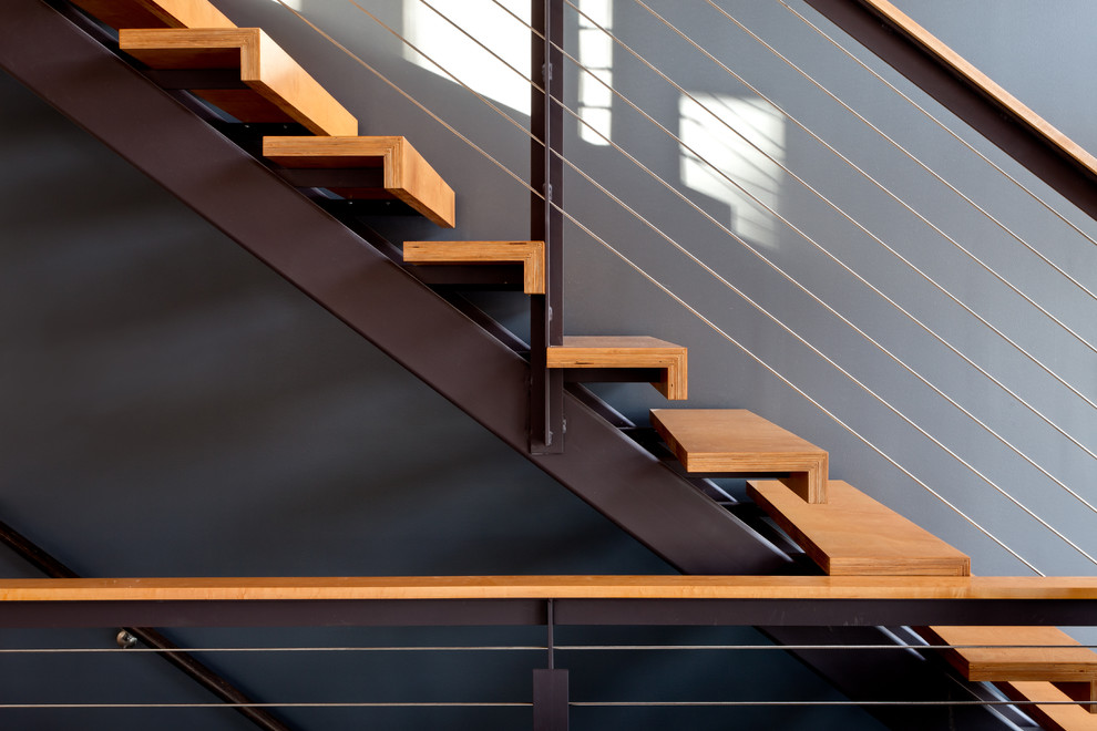 This is an example of a modern straight staircase in Other with open risers.