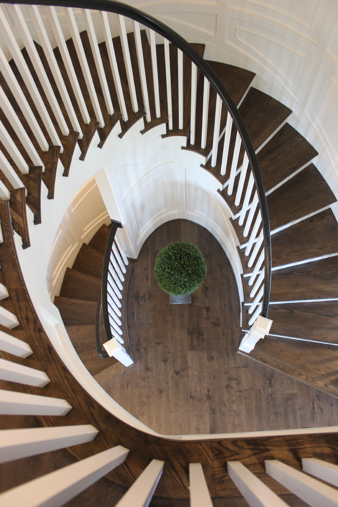 Design ideas for an expansive bohemian wood curved wood railing staircase in DC Metro with wood risers.