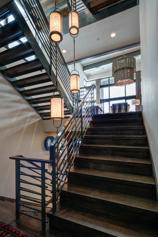 Example of a mid-sized urban wooden u-shaped metal railing staircase design in Salt Lake City with wooden risers