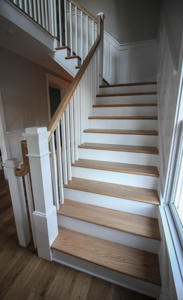 Inspiration for a large shabby-chic style wood l-shaped wood railing staircase in DC Metro with wood risers.