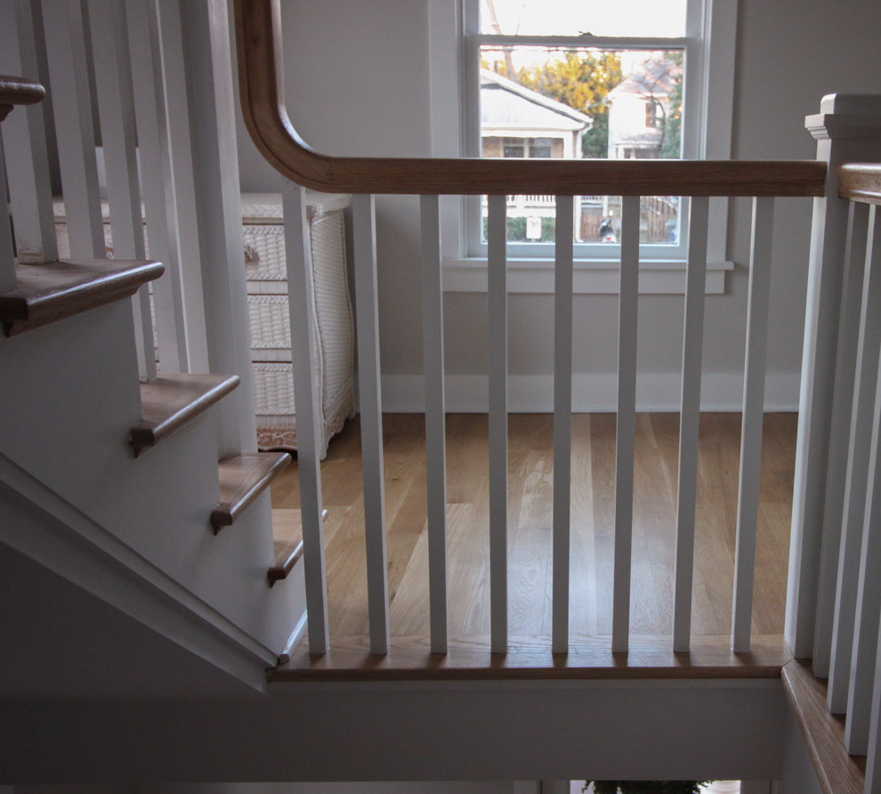 Design ideas for a large shabby-chic style wood l-shaped wood railing staircase in DC Metro with wood risers.
