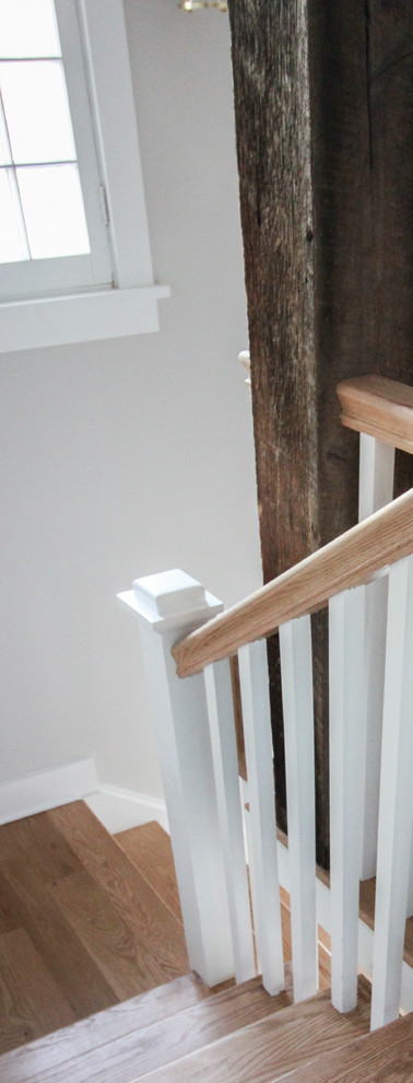 Inspiration for a large shabby-chic style wood l-shaped wood railing staircase in DC Metro with wood risers.