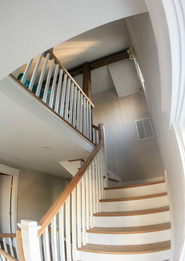Large cottage chic wooden l-shaped wood railing staircase photo in DC Metro with wooden risers