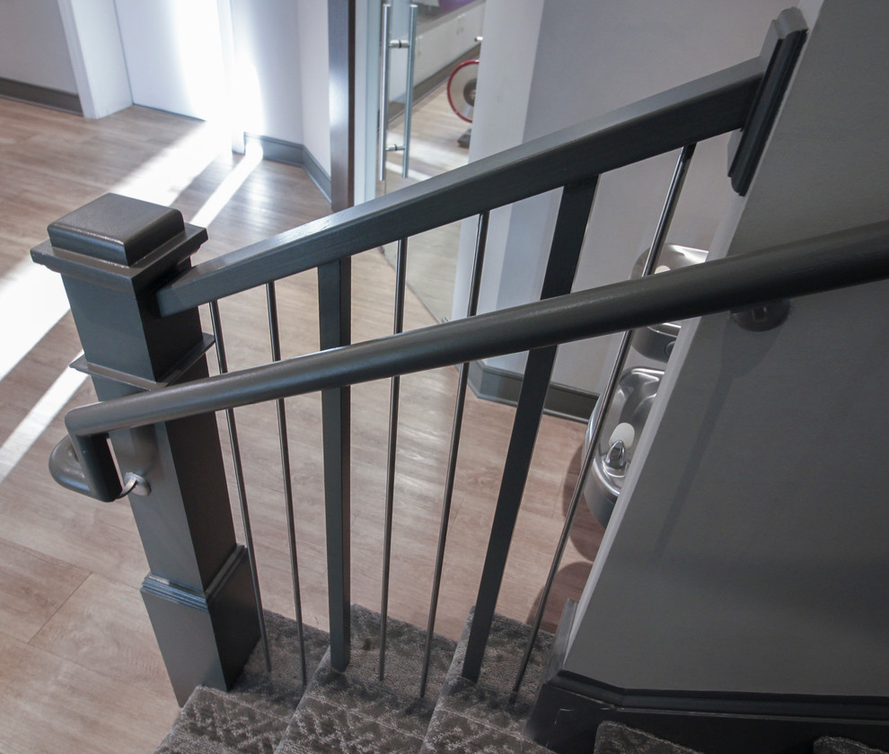 Small industrial wood u-shaped metal railing staircase in DC Metro with wood risers.