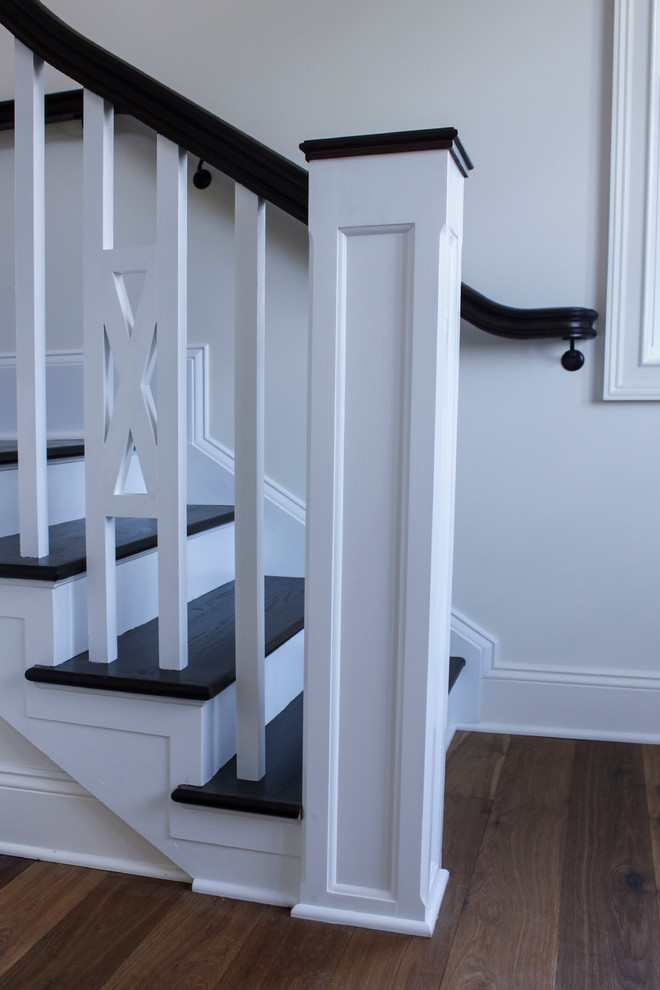 Example of a small farmhouse wooden l-shaped wood railing staircase design in DC Metro with wooden risers