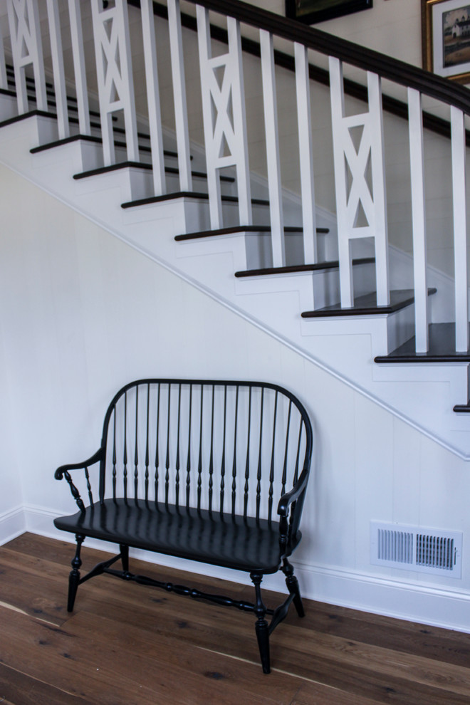 This is an example of a small rural wood l-shaped wood railing staircase in DC Metro with wood risers.