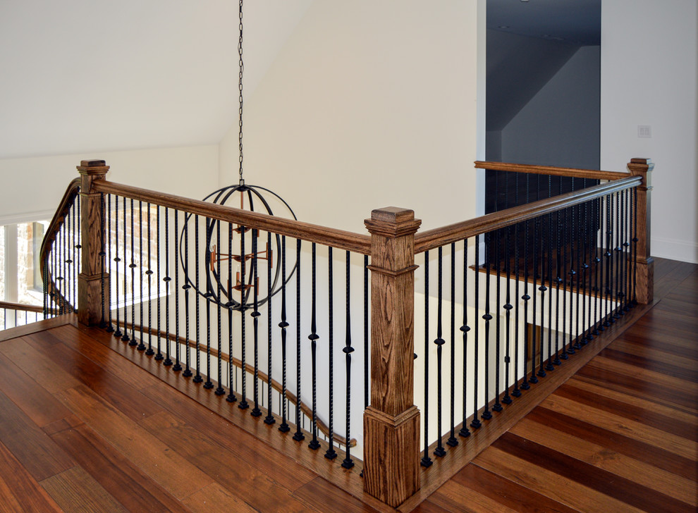 This is an example of an expansive bohemian wood floating mixed railing staircase in DC Metro with wood risers.