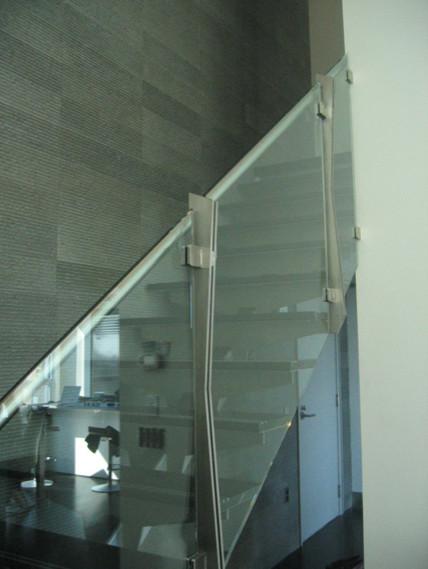 Photo of a modern staircase in Boston with feature lighting.