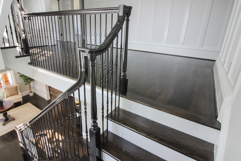 Example of a large transitional wooden floating mixed material railing staircase design in DC Metro with wooden risers