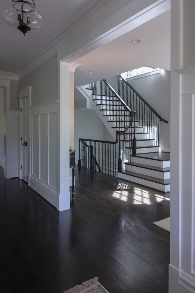 Design ideas for a large traditional wood floating mixed railing staircase in DC Metro with wood risers.