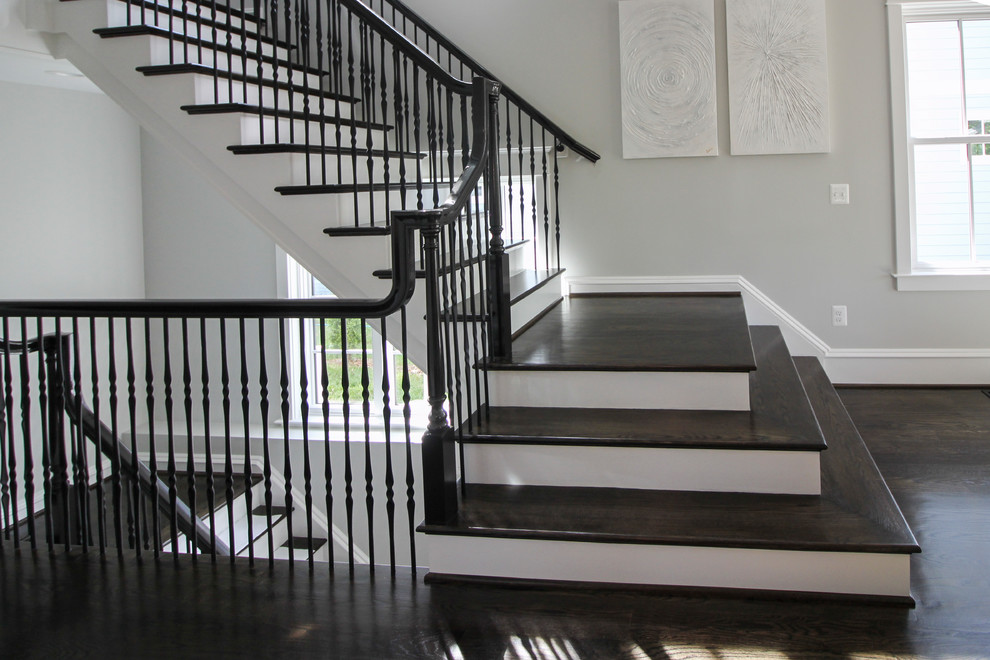 Large classic wood floating mixed railing staircase in DC Metro with wood risers.