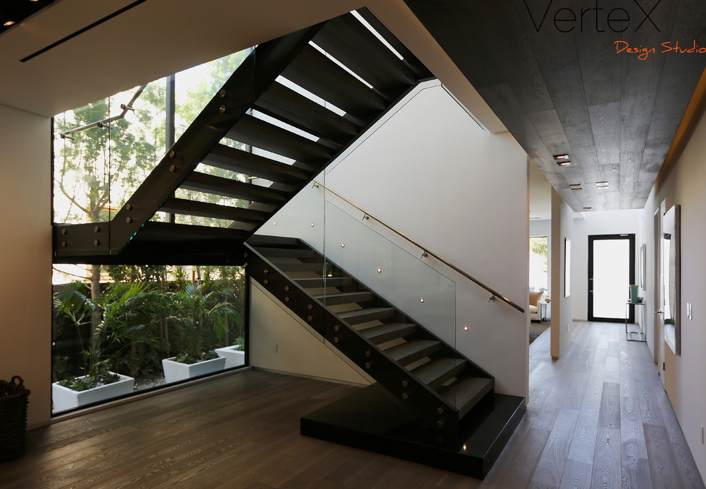 Staircase - large modern wooden u-shaped open staircase idea in Los Angeles