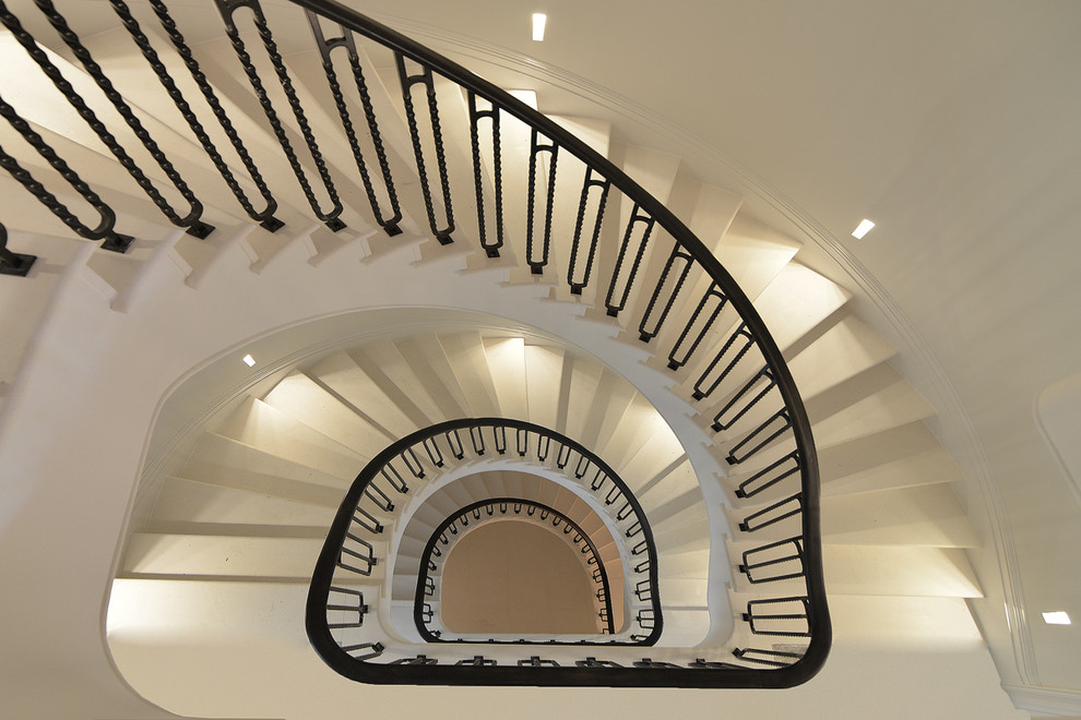 Example of a large trendy spiral staircase design in London