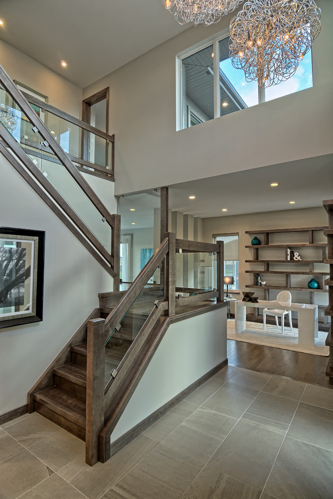 Photo of a contemporary wood u-shaped staircase in Other with wood risers.