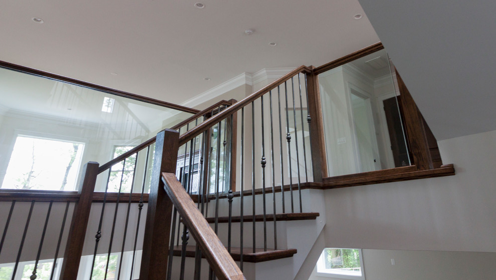 Inspiration for an expansive contemporary wood floating glass railing staircase in DC Metro with wood risers.