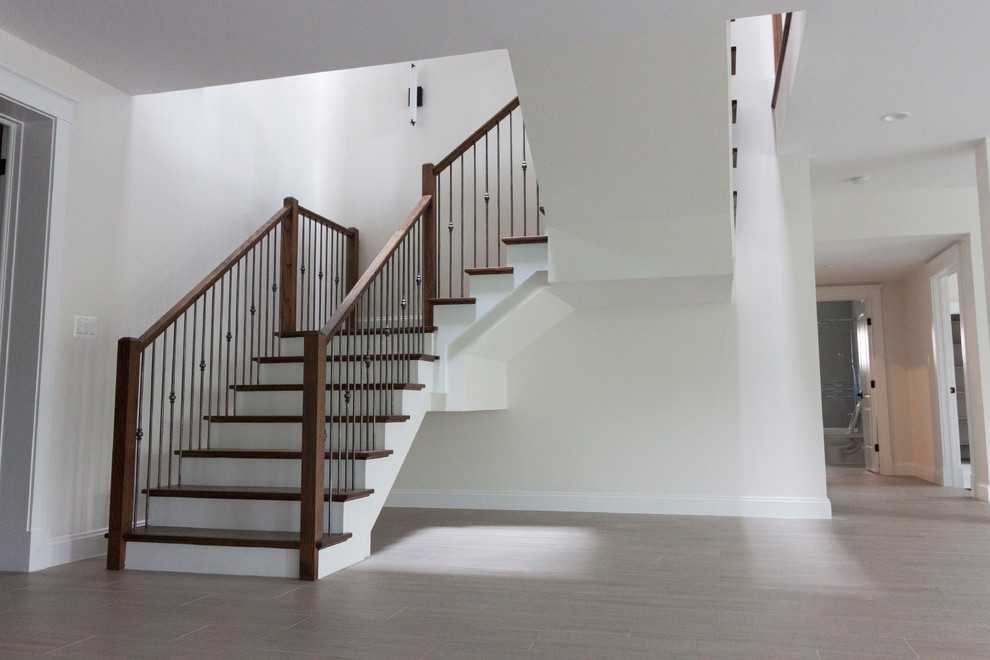 Staircase - huge contemporary wooden floating glass railing staircase idea in DC Metro with wooden risers