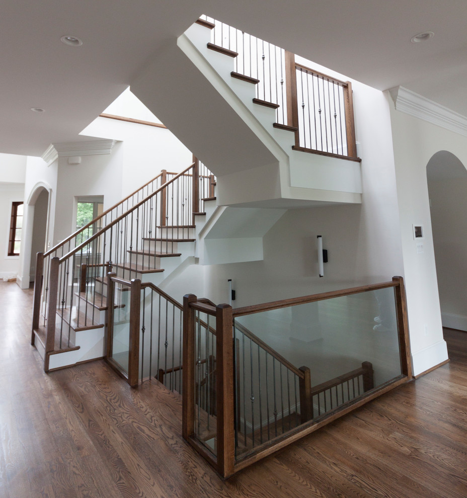 Staircase - huge contemporary wooden floating glass railing staircase idea in DC Metro with wooden risers
