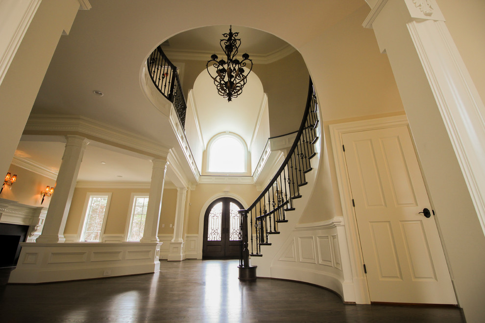 Staircase - mid-sized traditional wooden curved mixed material railing staircase idea in DC Metro with wooden risers