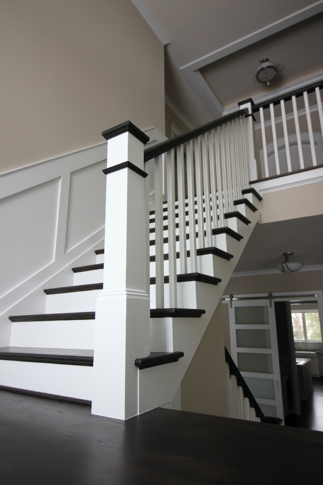 Staircase - large modern wooden u-shaped wood railing staircase idea in DC Metro with wooden risers