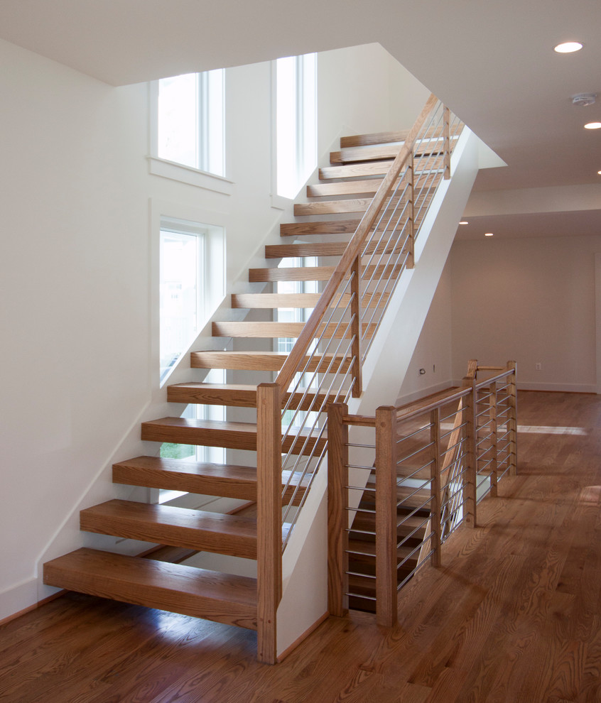 Inspiration for a large contemporary wooden floating mixed material railing staircase remodel in DC Metro