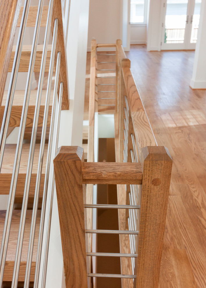 Inspiration for a large contemporary wooden floating mixed material railing staircase remodel in DC Metro