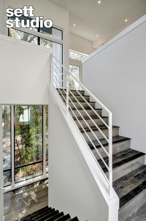 Inspiration for a modern metal railing staircase in Austin.