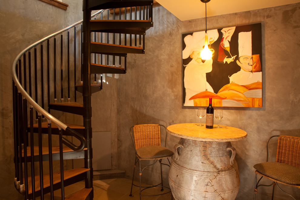 This is an example of a rustic wood spiral staircase in Other with open risers.
