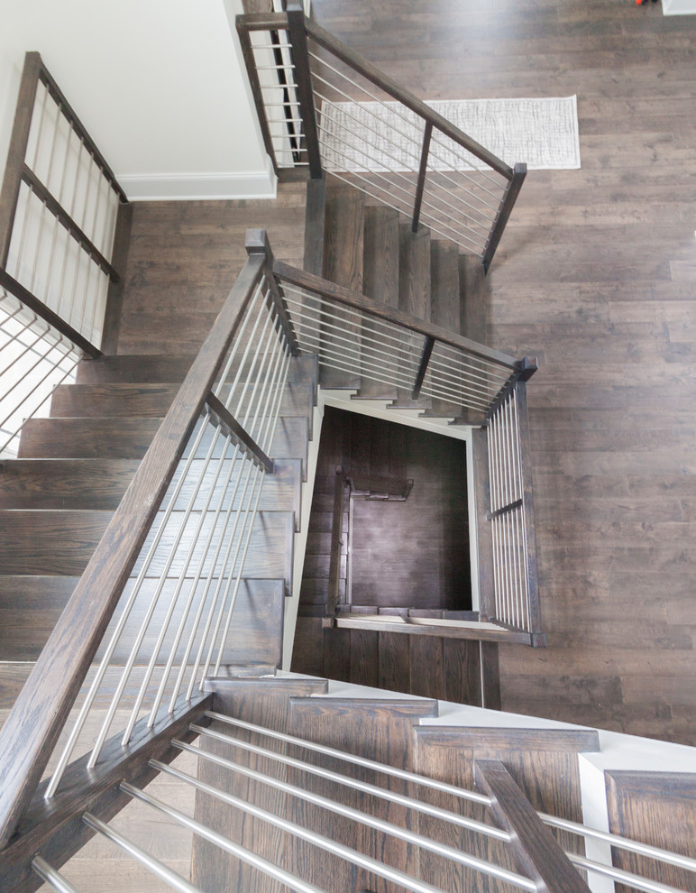 Large transitional wooden u-shaped mixed material railing staircase photo in DC Metro with wooden risers