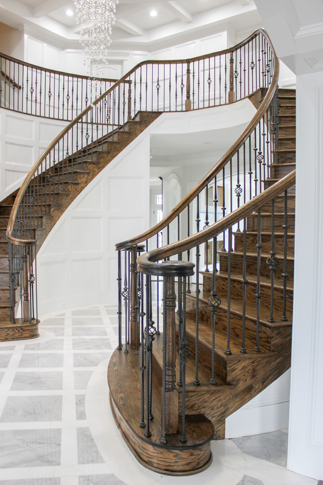 Inspiration for a large contemporary wooden curved mixed material railing staircase remodel in DC Metro with wooden risers