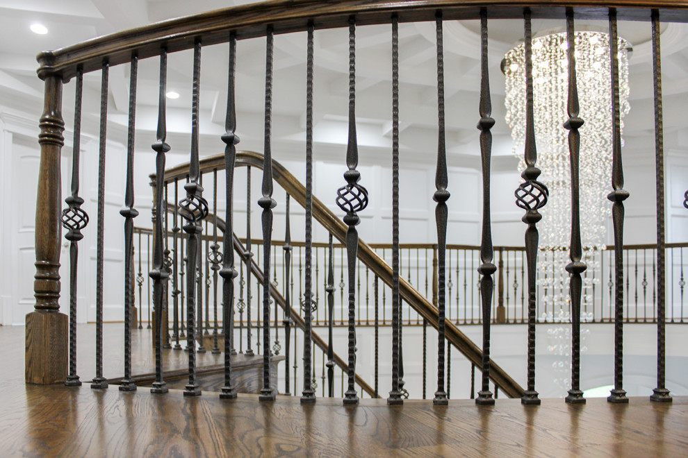 Inspiration for a large contemporary wood curved mixed railing staircase in DC Metro with wood risers.