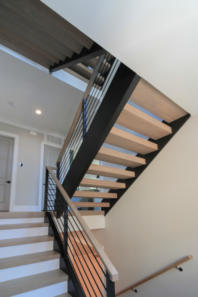 Inspiration for a large modern wooden floating mixed material railing staircase remodel in DC Metro