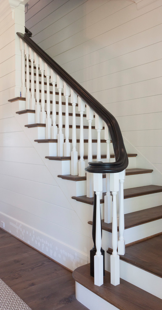 Large romantic wood straight wood railing staircase in DC Metro with wood risers.