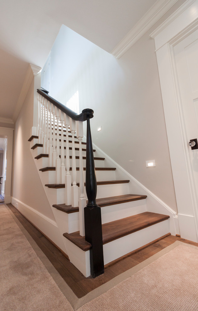 Photo of a large vintage wood straight wood railing staircase in DC Metro with wood risers.