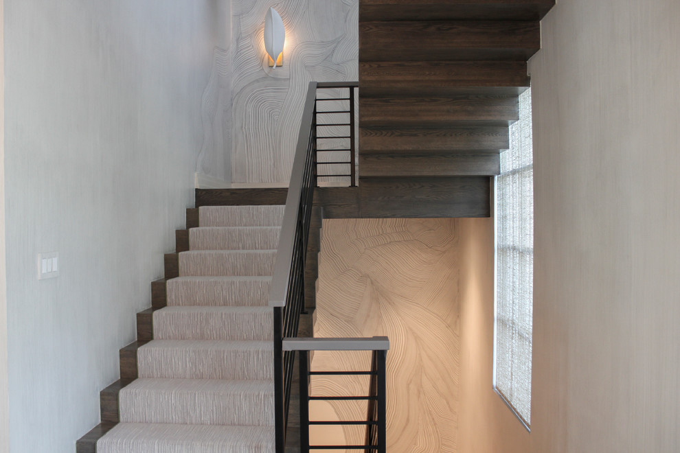 Inspiration for a large bohemian wood floating metal railing staircase in DC Metro with wood risers.