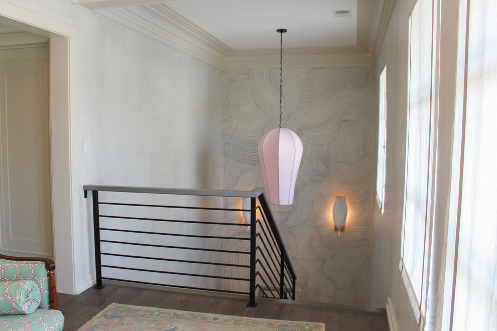 This is an example of a large eclectic wood floating metal railing staircase in DC Metro with wood risers.